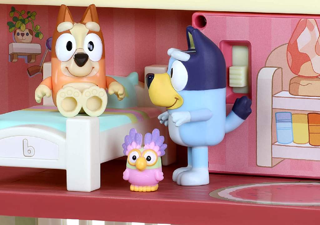 Zoomed in image showing a close up of Bluey, Bingo, and Chattermax in the Bluey Playhouse.