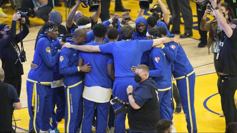 The Golden State Warriors in a huddle.