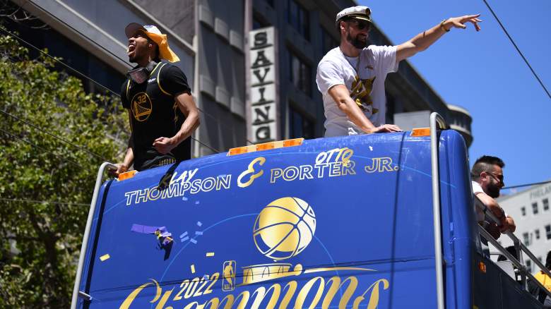 Warriors Otto Porter Jr. (left) and Klay Thompson celebrate the team's 2022 NBA championship.