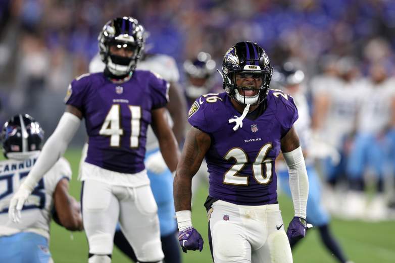 Ravens safety Geno Stone celebrates after a big blay