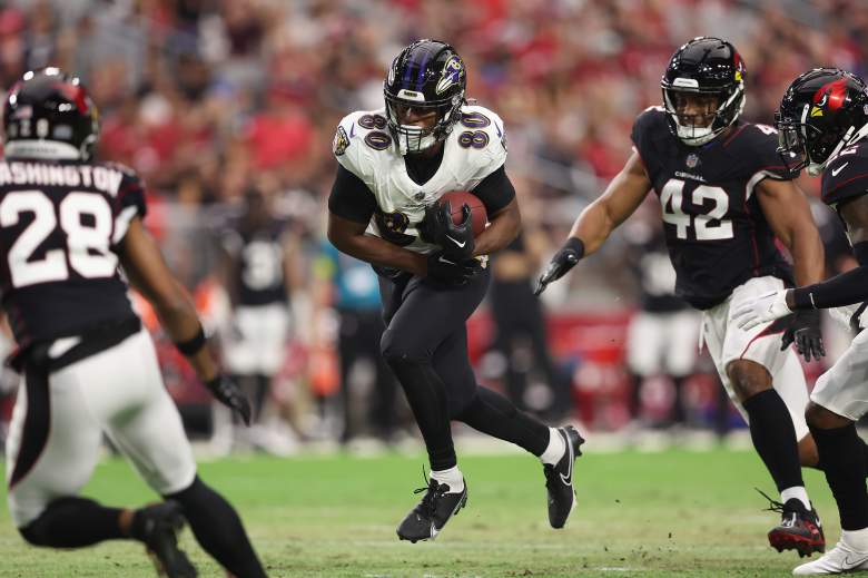Ravens TE Isaiah Likely runs after the catch
