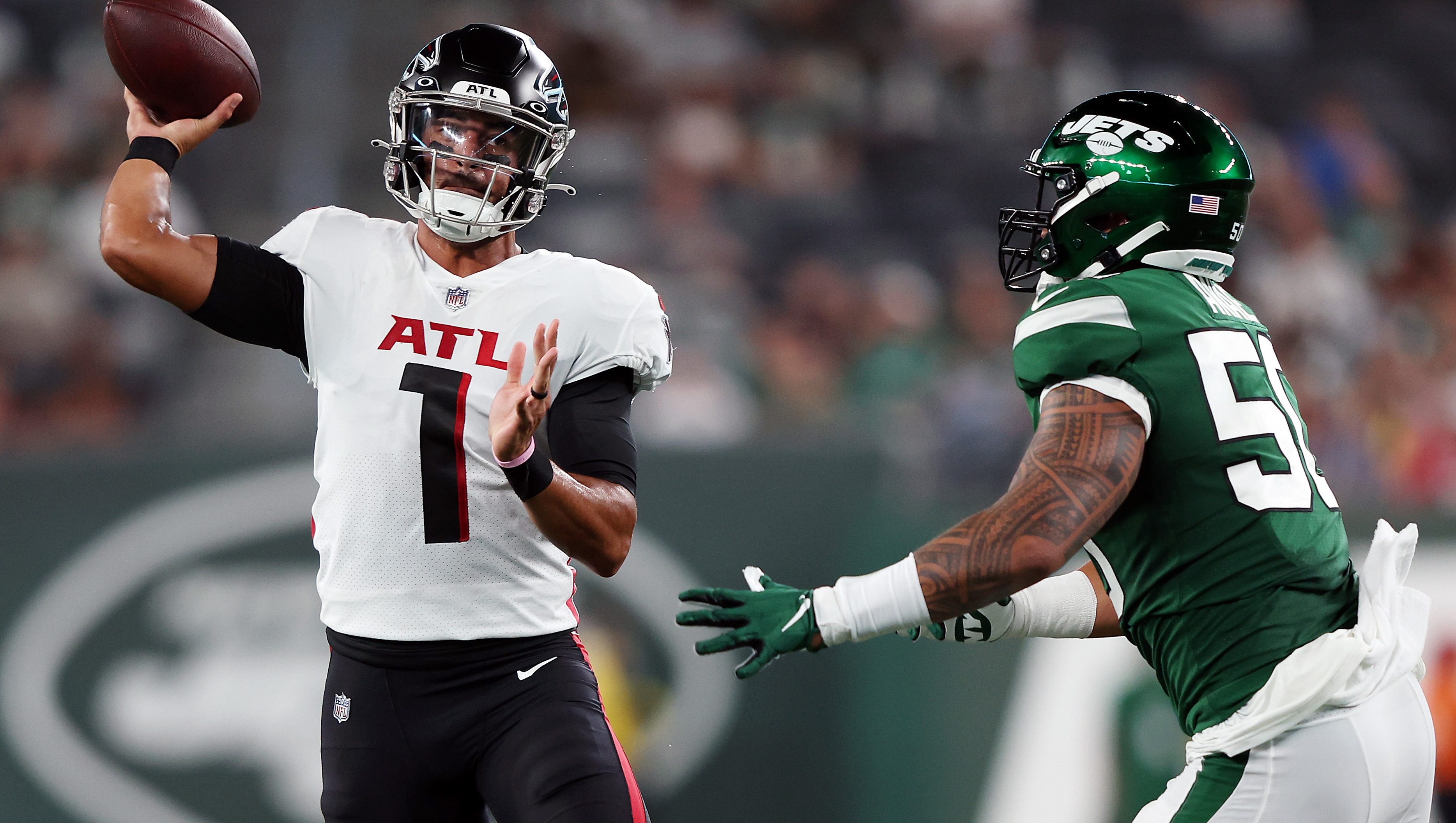 Desmond Ridder of the Atlanta Falcons rolls out to pass during the News  Photo - Getty Images