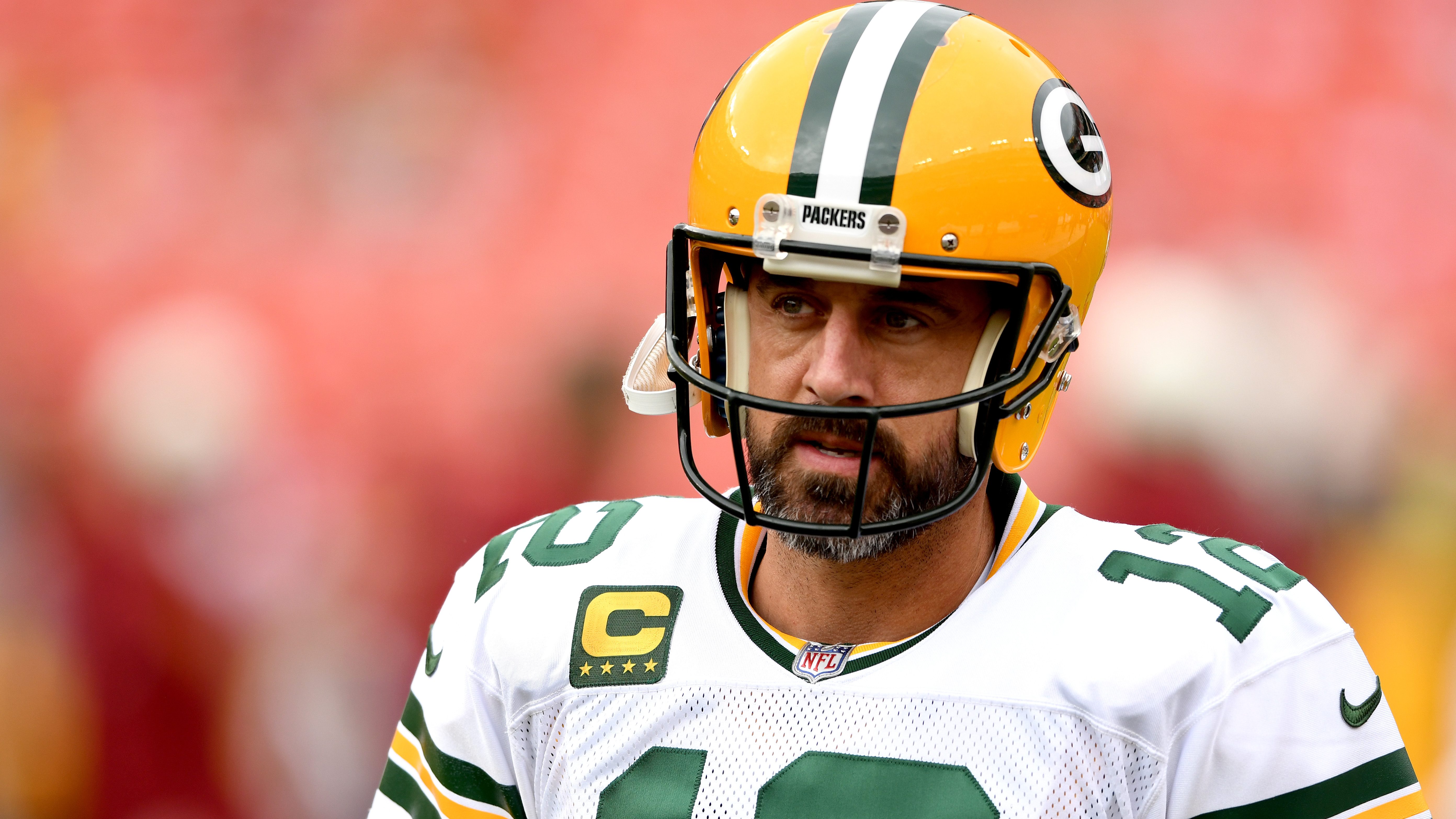 GREEN BAY, WI - OCTOBER 16: Green Bay Packers quarterback Aaron Rodgers  (12) drops to pass during a game between the Green Bay Packers and the New  York Jets at Lambeau Field