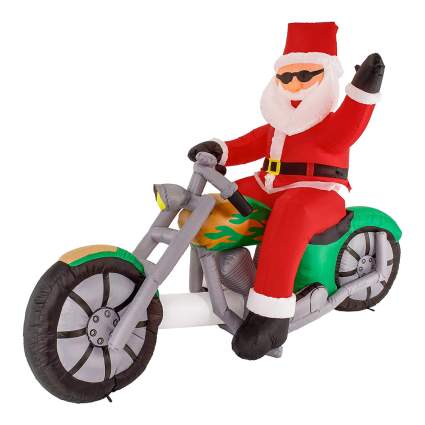 Inflatable santa on a motorcycle yard decoration