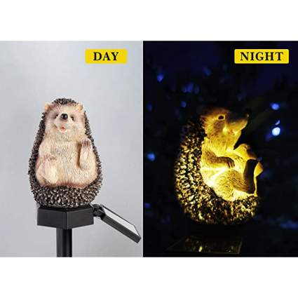 Little hedgehog garden statue in daylight and lit up at night