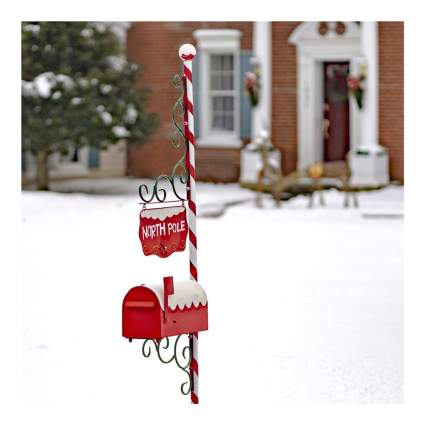 red and white north pole christmas mailbox