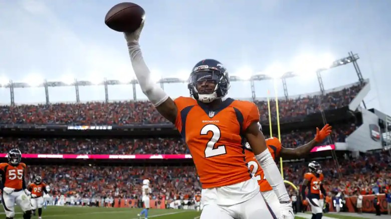 Denver Broncos' Patrick Surtain celebrates after an interception