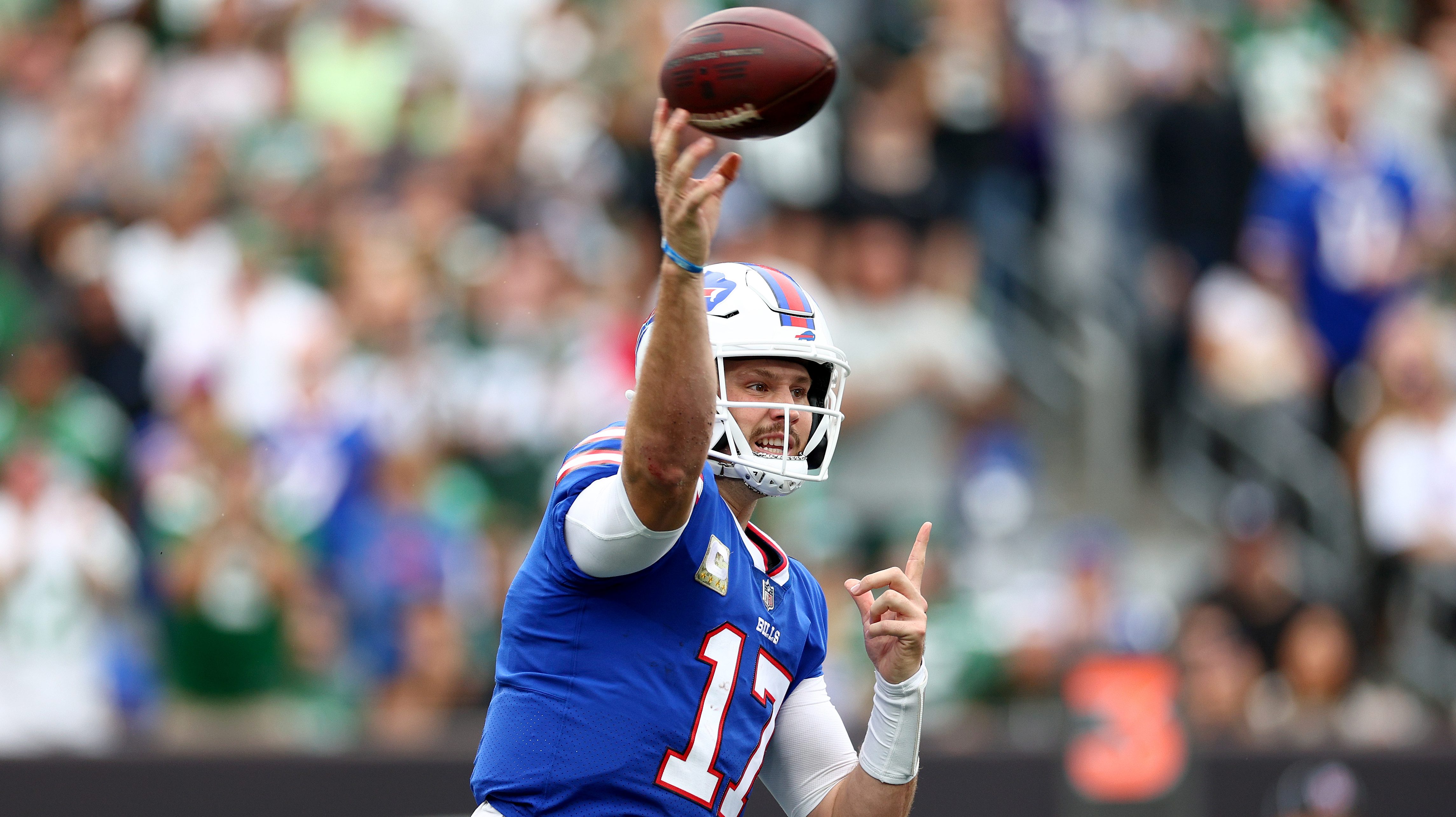 Josh Allen wears red Buffalo Bills helmet at Highmark Stadium practice 