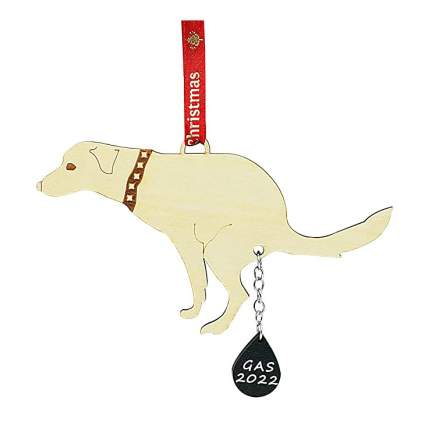 Weird Christmas ornament of a dog pooping out the phrase "Gas 2022"