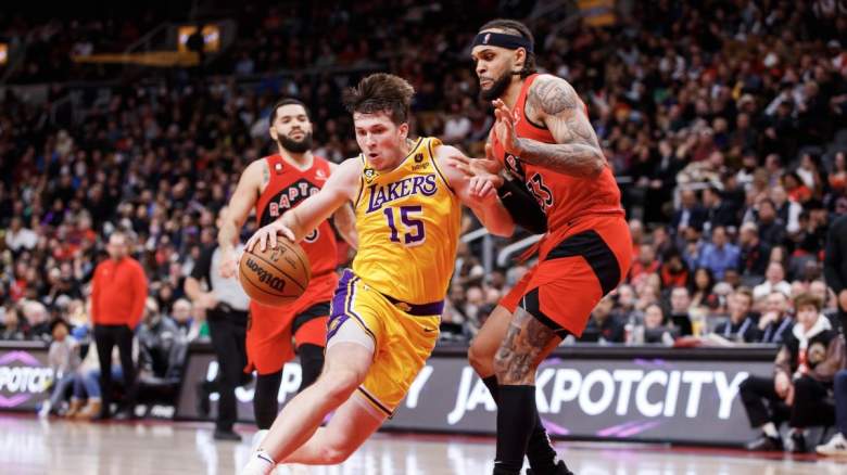Lakers guard Austin Reaves drives on Raptors forward Gary Trent Jr.