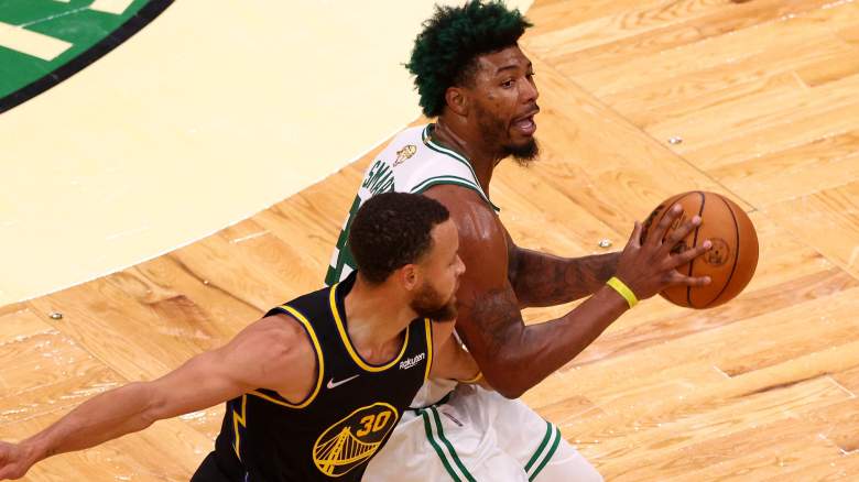 Marcus Smart, Celtics (with ball), and the Warriors' Stephen Curry