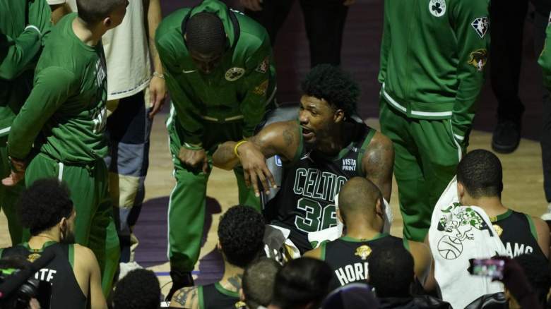 The Boston Celtics in a huddle.