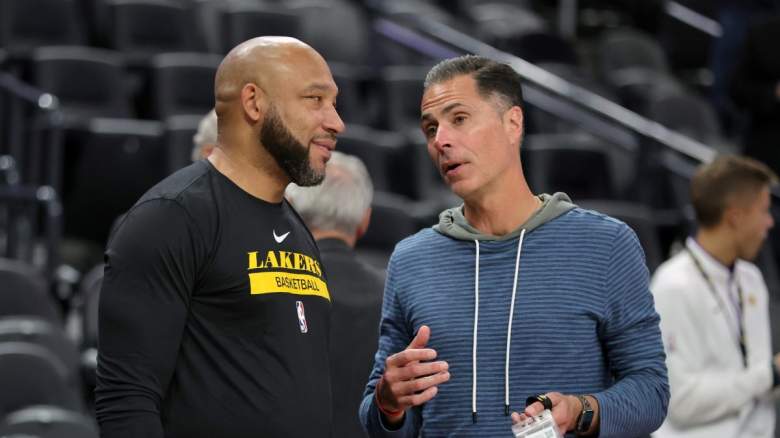 Lakers head coach Darvin Ham (left) talks to GM Rob Pelinka