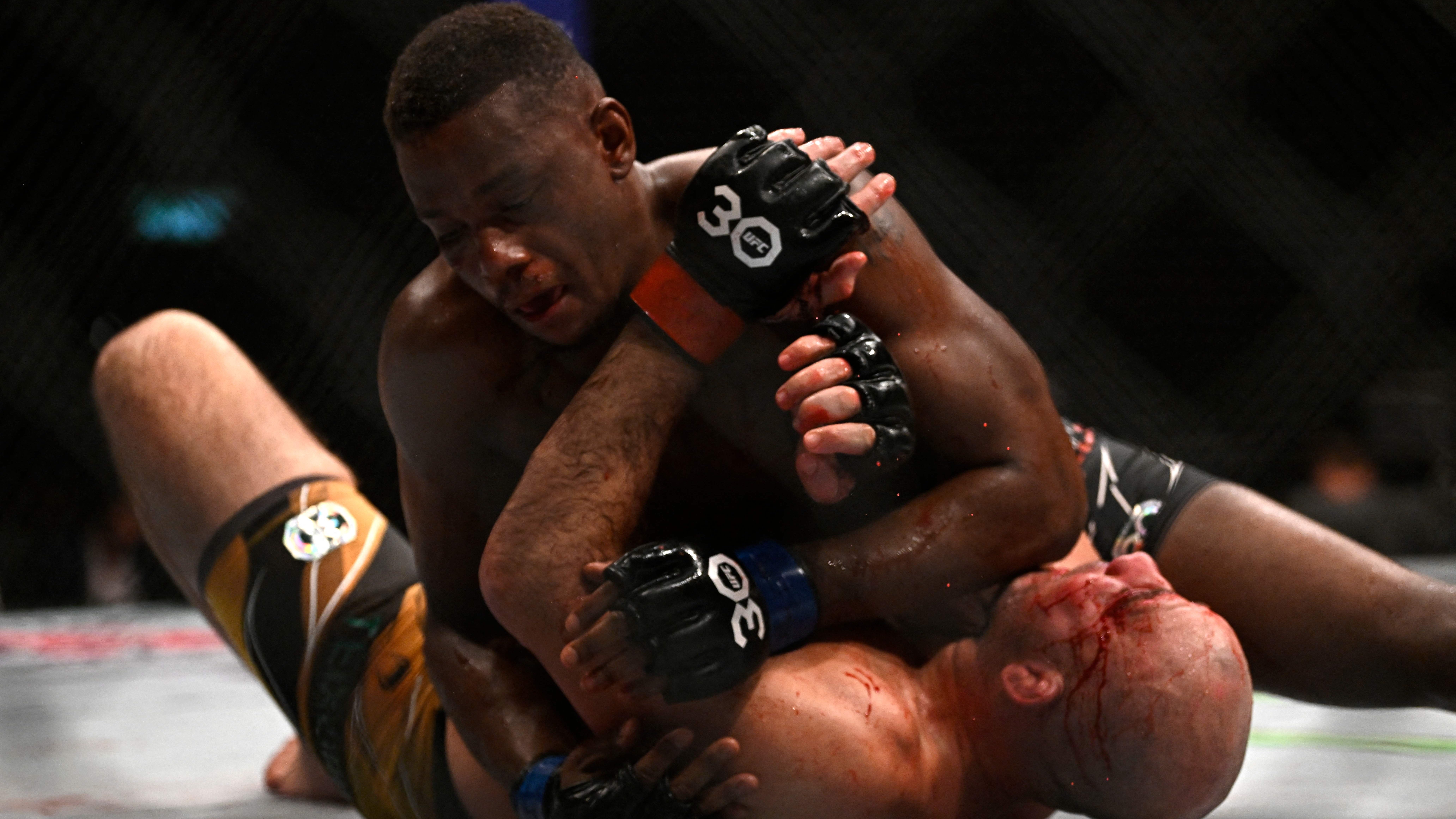 Jon Jones and Others React to Jamahal Hill Becoming 205-Pound UFC Champ Heavy
