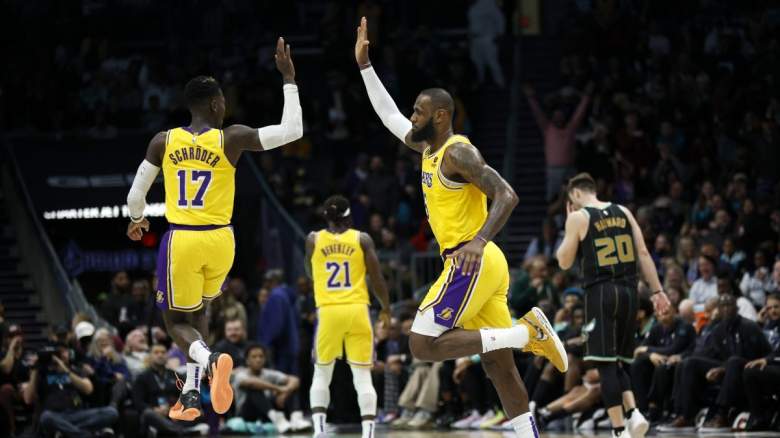 Lakers guard Dennis Schroder high-fives superstar LeBron James on January 2, 2023