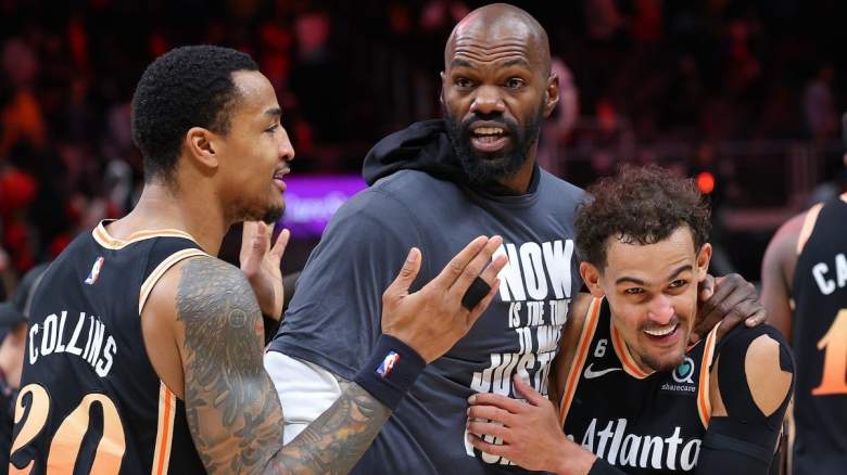 John Collins and Trae Young chat with Dewayne Dedmon of the Miami Heat