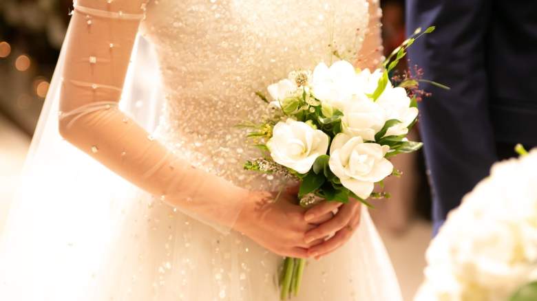 Bride with white flower bouquet
