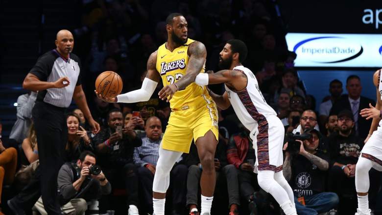 Kyrie Irving guards LeBron James