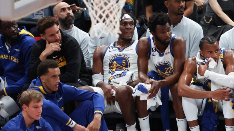 Patrick Baldwin Jr. sits with his Golden State Warriors teammates.
