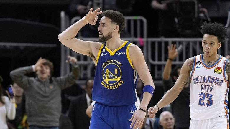 Klay Thompson of the Golden State Warriors and Tre Mann of the Oklahoma City Thunder.