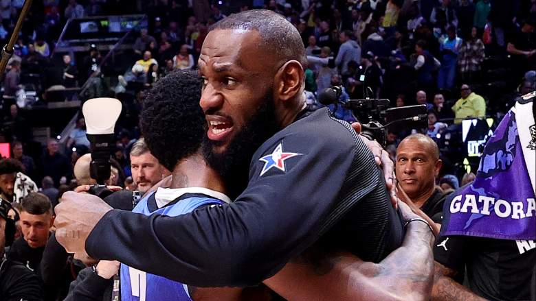 Kyrie Irving of the Dallas Mavericks hugs LeBron James of the Los Angeles Lakers.