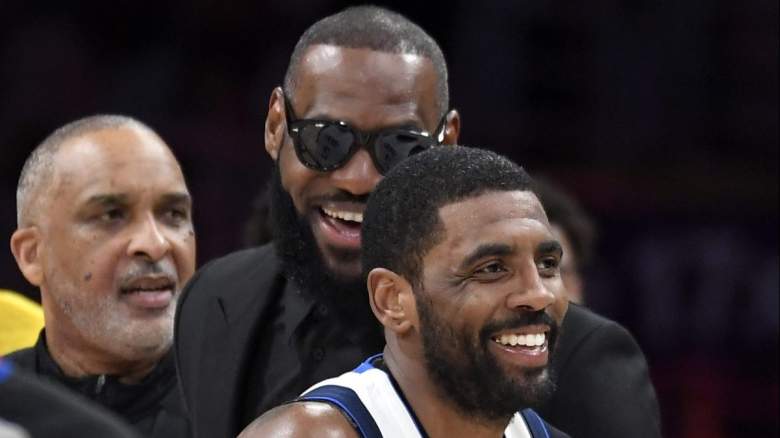 Kyrie Irving of the Dallas Mavericks shares a laugh with Los Angeles Lakers forward LeBron James.