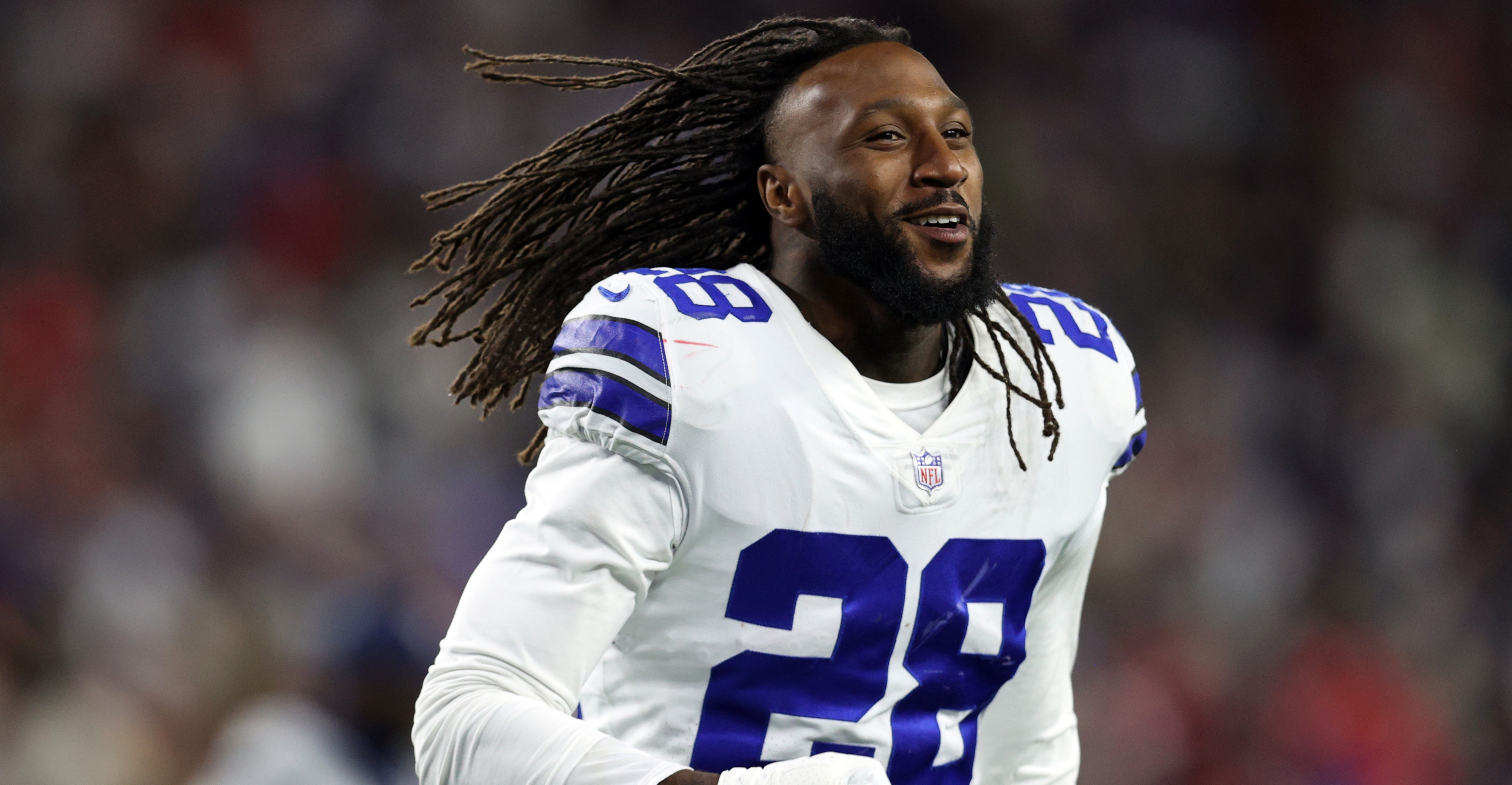 Safety (28) Malik Hooker of the Dallas Cowboys warms up before