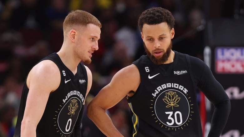 Donte DiVincenzo and Stephen Curry of the Golden State Warriors.