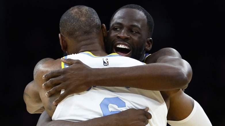 Golden State Warriors forward Draymond Green hugs LeBron James of the Los Angeles Lakers.