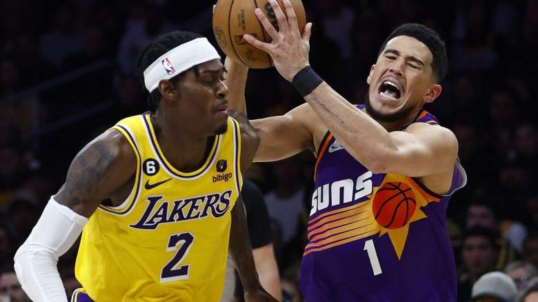 Jarred Vanderbilt of the Los Angeles Lakers and Devin Booker of the Phoenix Suns.