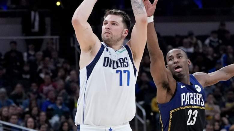 Luka Doncic of the Dallas Mavericks and Aaron Nesmith of the Indiana pacers.