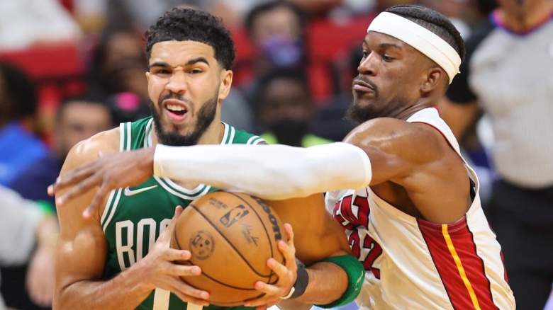 Jimmy Butler of the Miami Heat defends Boston Celtics star Jayson Tatum.