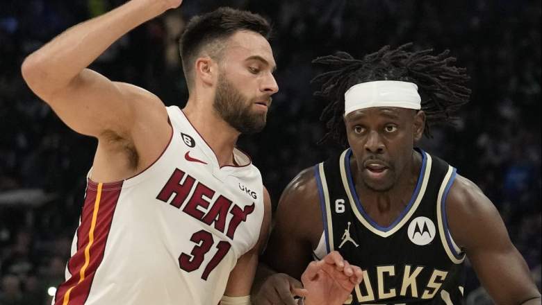 Miami Heat wing Max Strus guards Jrue Holiday of the Milwaukee Bucks.