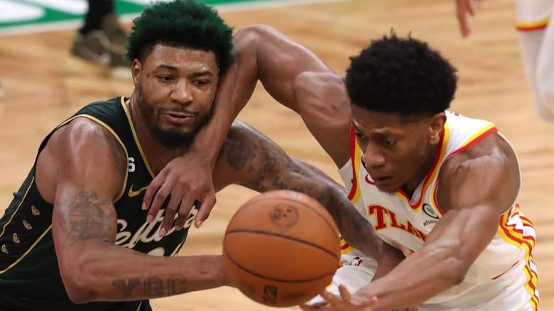Marcus Smart of the Boston Celtics battles for a loose ball.