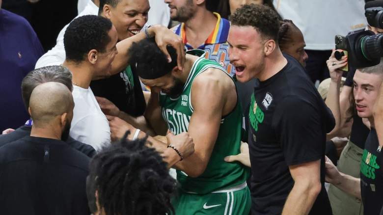 Derrick White is congratulated by his Boston Celtics teammates