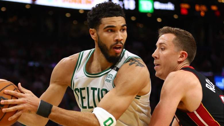 Boston Celtics star Jayson Tatum is defended by Duncan Robinson of the Miami Heat.