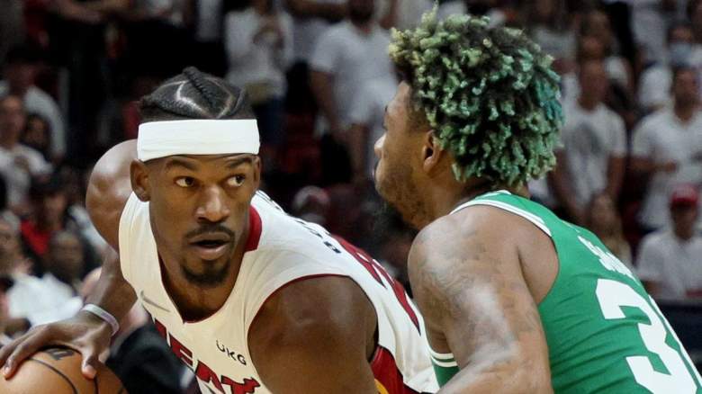 Miami Heat star Jimmy Butler is guarded by Marcus Smart of the Boston Celtics.