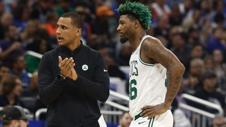 Joe Mazzulla, Celtics coach, talks with Marcus Smart.