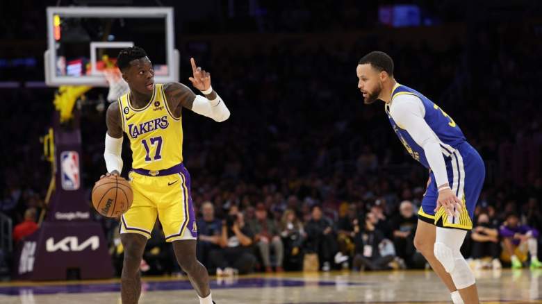 Warriors' Stephen Curry guards Lakers' Dennis Schroder
