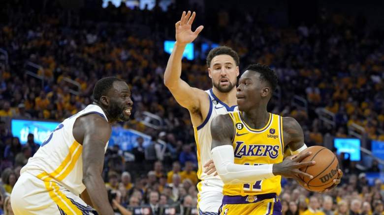 Warriors stars Klay Thompson and Draymond Green guard Lakers' Dennis Schroder