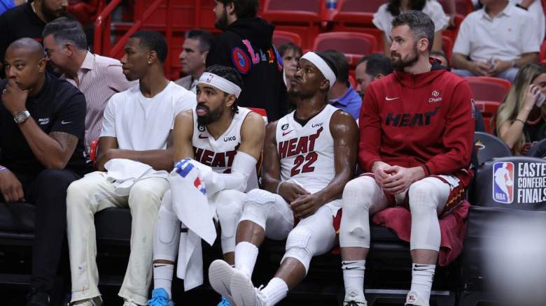 Gabe Vincent and Jimmy Butler sit on the Miami Heat bench.