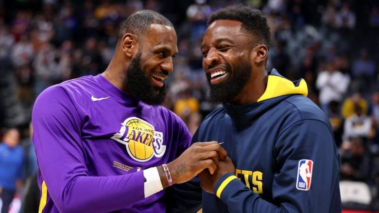 Los Angeles Lakers star LeBron James chats with Jeff Green of the Denver Nuggets.