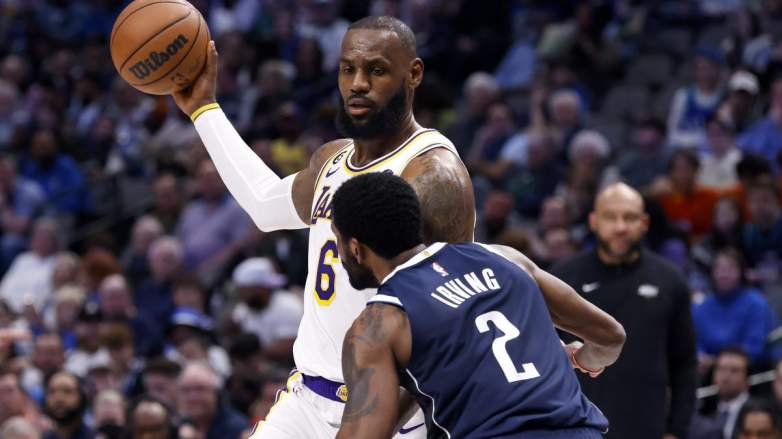 Dallas Mavericks guard Kyrie Irving defends LeBron James of the Los Angeles Lakers.