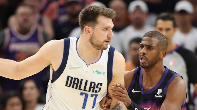 Dallas Mavericks star Luka Doncic is defended by Chris Paul of the Phoenix Suns.