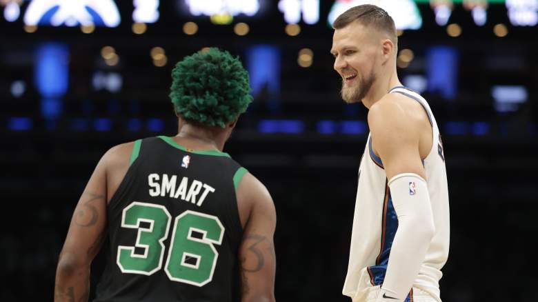 Marcus Smart (left) is out, traded by the Celtics for Kristaps Porzingis (right).