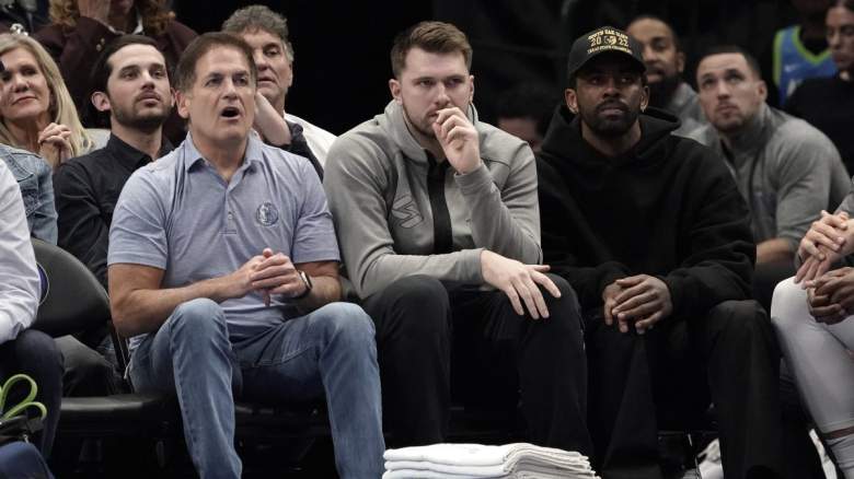 Mavericks owner Mark Cuban sits next to Luka Doncic and Kyrie Irving