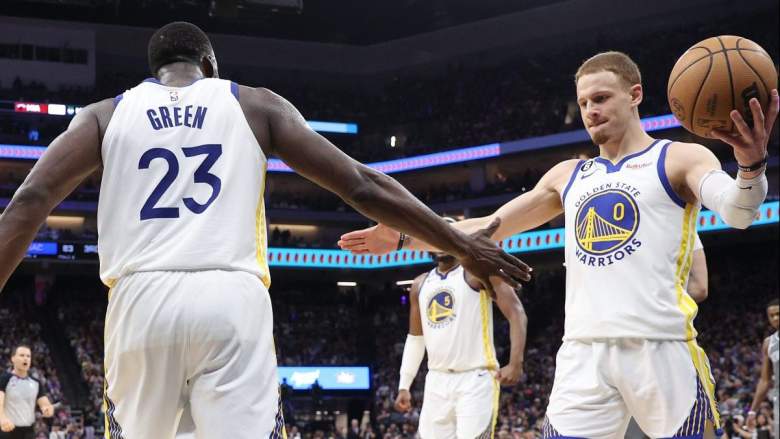 Draymond Green and Donte DiVincenzo of the Golden State Warriors.