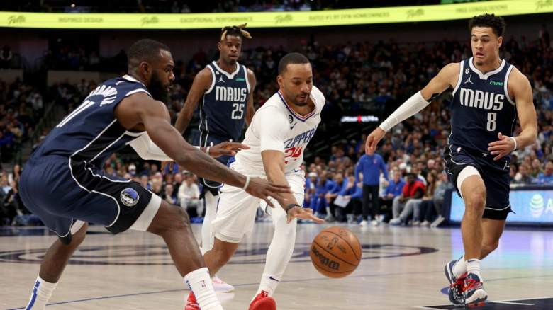 Norman Powell #24 of the LA Clippers drives to the basket against Tim Hardaway Jr. #11 of the Dallas Mavericks and Josh Green #8 of the Dallas Mavericks