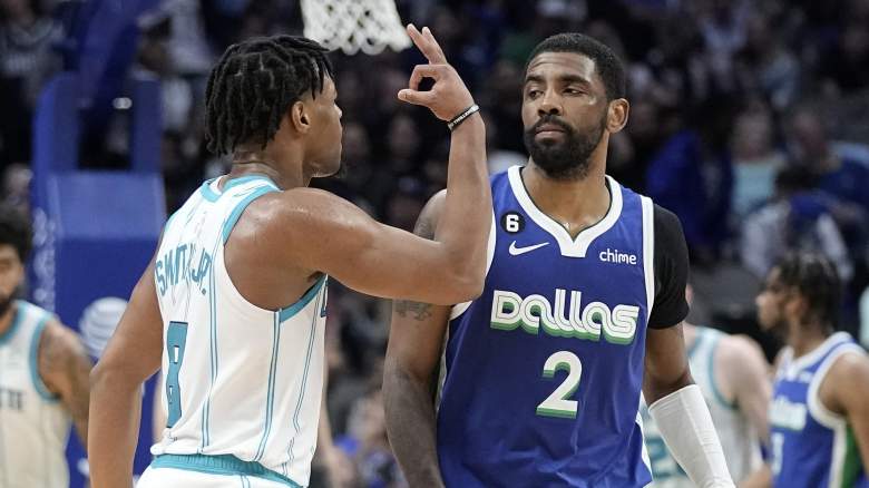 New Nets G Dennis Smith Jr. (left) taunts ex-Net Kyrie Irving during a March 2022 game between the Hornets and Mavericks.