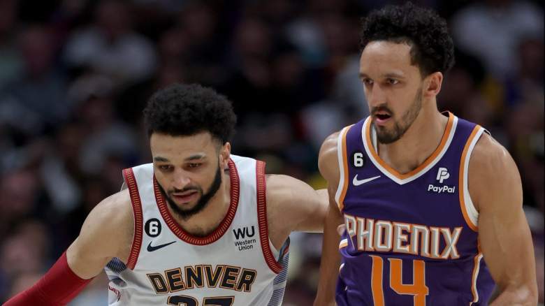 Phoenix Suns guard Landry Shamet guards Jamal Murray of the Denver Nuggets.
